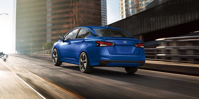 Blue Nissan Versa rental car