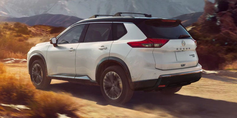 2025 Nissan Rogue driving away