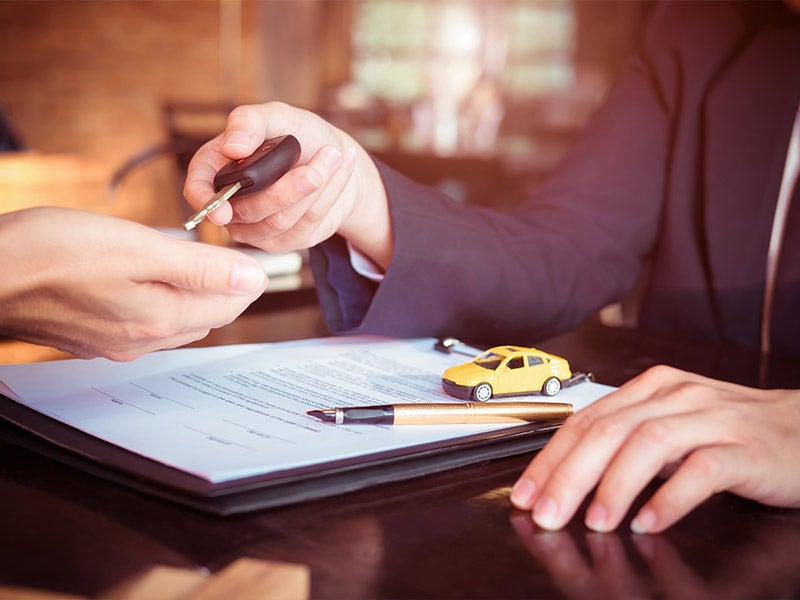 Financing paperwork at Nissan of Macomb in Clinton Township MI